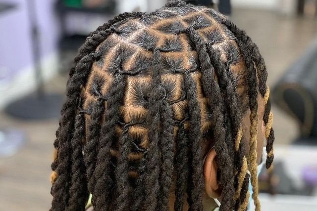 Man with intricate dreadlocks and twists