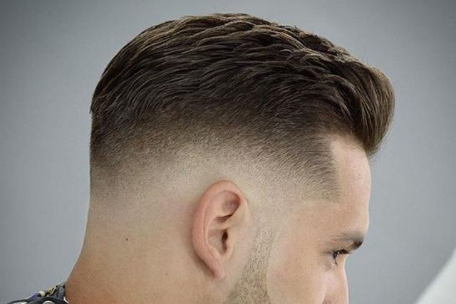 Professional low fade haircut with gradual transition